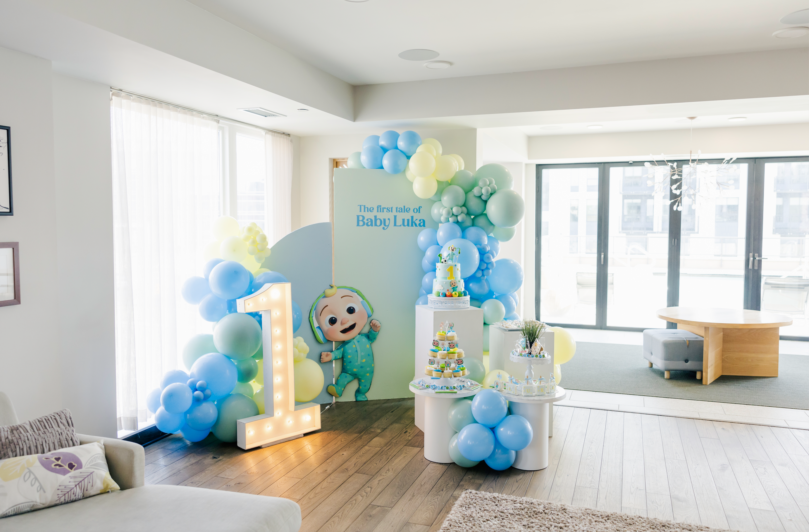 A cocomelon display for a boy's first birthday party