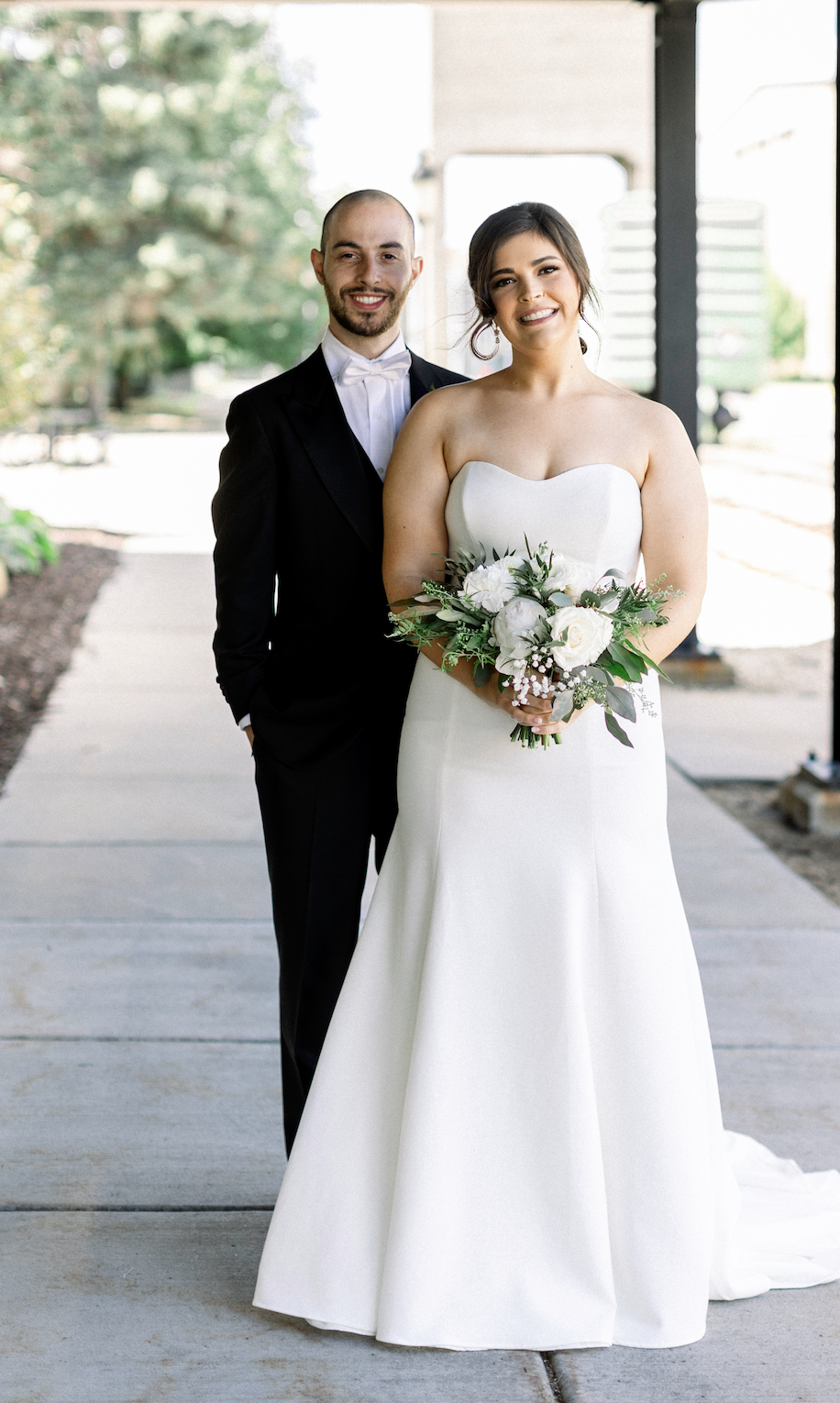 Bride and groom take portraits on their wedding day